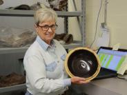 Volunteer Barb Fosheim processing the Chinatown collection.