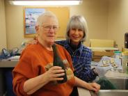 Volunteers Judy Farris and Susan Zepkin after a long day of washing artifacts.